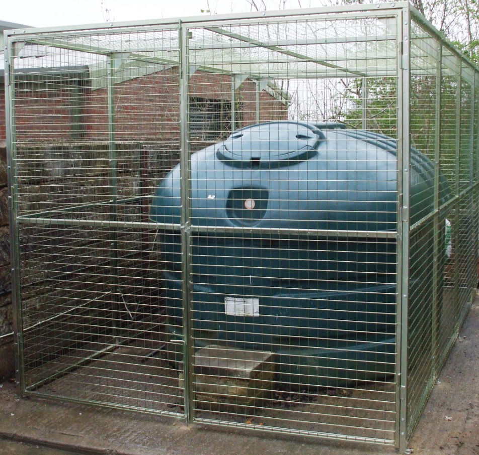 Photo of oil tank in a security cage